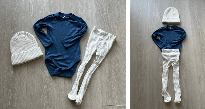a baby 's clothes are laid out on a wooden floor